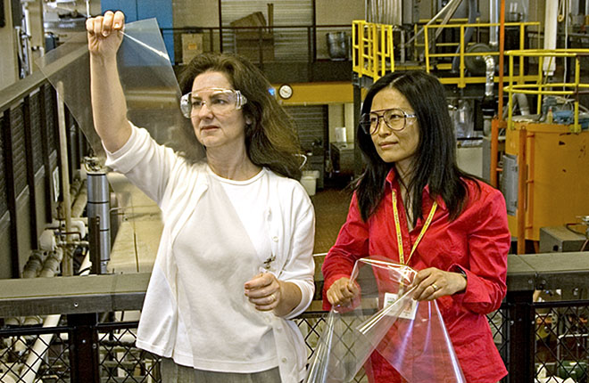 Two scientists inspecting casein films