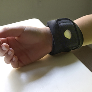 Wristband monitor on study participant.