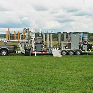 Mobile pyrolysis system on a farm field.