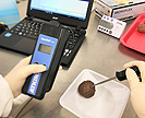 Measuring temperature of cooked meatballs